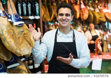 Seller in delicatessen section Seller in delicatessen section 41879579