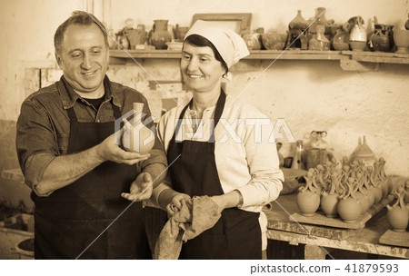 Couple among the pottery 41879593