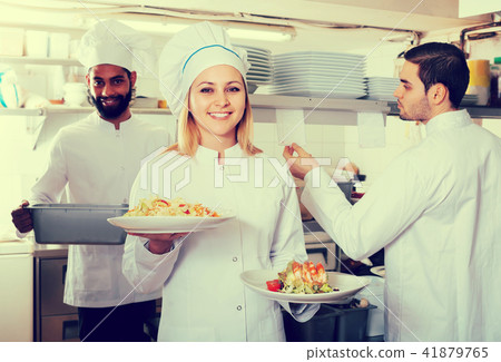 Crew of professional cooks working at restaurant 41879765