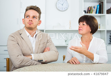 Mother calms the son 41879847