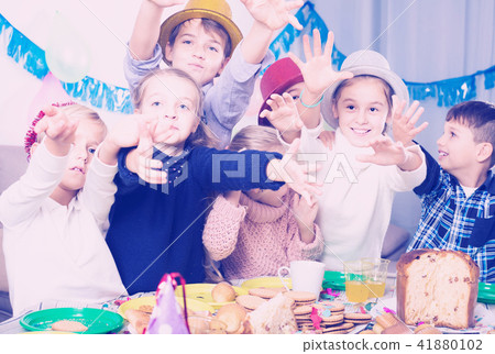 children having celebration of friend’s birthday during dinner children having celebration of friend’s birthday during dinner 41880102
