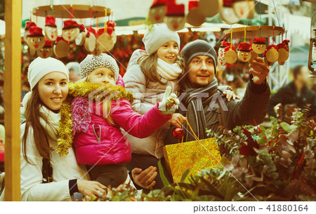 Family with children purchasing toys Family with children purchasing toys 41880164