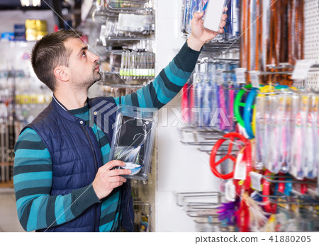Young fisherman choosing fishing lures 41880205