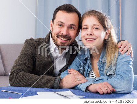 Father helping daughter with homework Father helping daughter with homework 41880206