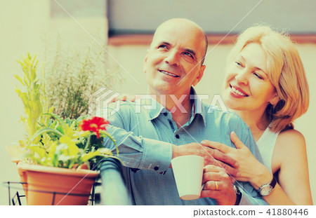 Couple drinking tea at balcony Couple drinking tea at balcony 41880446