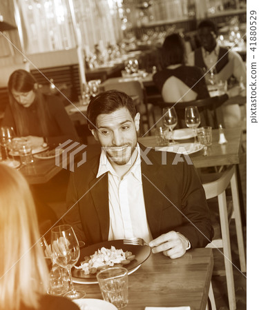 Smiling man with female in restaurant 41880529