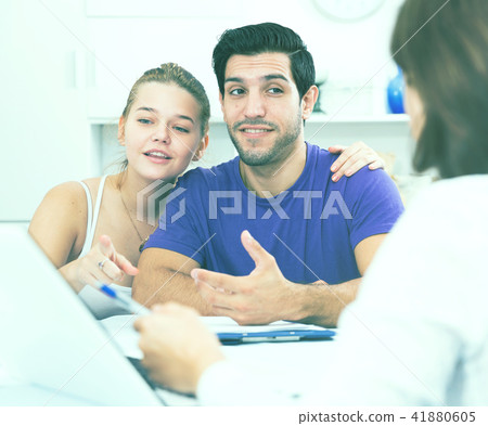 Young couple meeting financial adviser at home Young couple meeting financial adviser at home 41880605