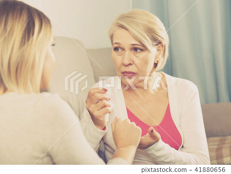 daughter comforts a sad mother daughter comforts a sad mother 41880656