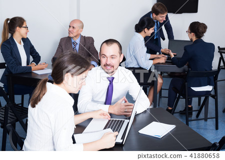 Employees having a productive day at work Employees having a productive day at work 41880658