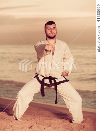 Man is training the Shiko-dachi stance 41880699