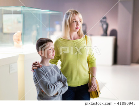 Mother and son looking at expositions in museum Mother and son looking at expositions in museum 41880943