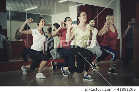 Happy people dancing in gym Happy people dancing in gym 41881209