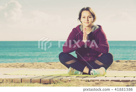 girl exercising on exercise mat outdoor 41881386