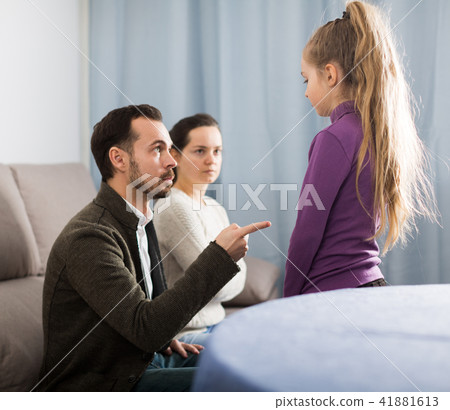 Parents lecturing daughter 41881613