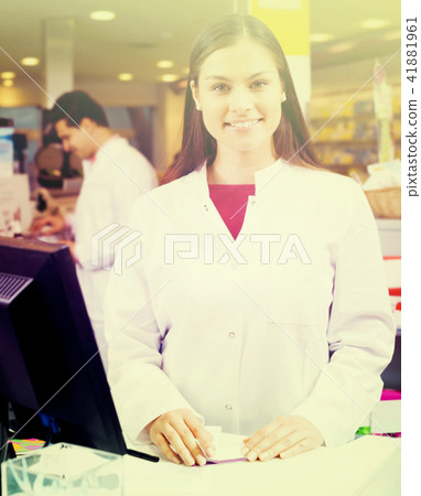 Portrait of pharmacist and assistant working Portrait of pharmacist and assistant working 41881961