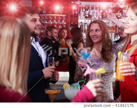 Woman with friends at nightclub 41882176