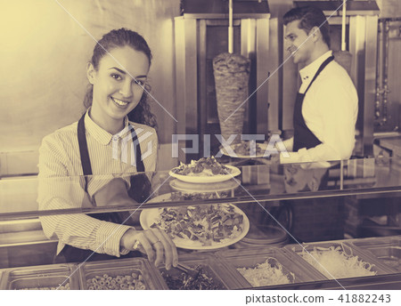 Staff posing at kebab counter 41882243