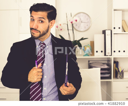 Spanish businessman is talking with partner about contract 41882910