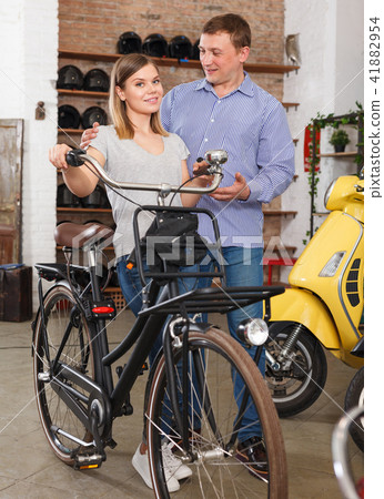 man with woman are satisfied of shopping bicycle 41882954
