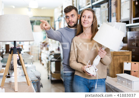 Couple choosing table lamp Couple choosing table lamp 41883037
