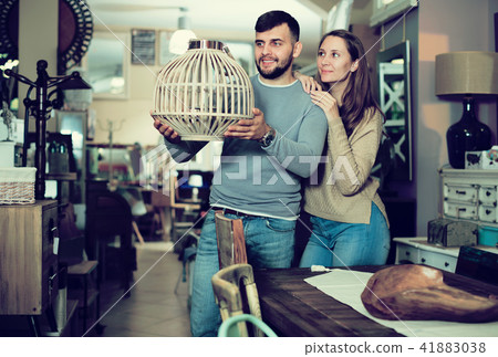 Girl with boyfriend in search of lampshade Girl with boyfriend in search of lampshade 41883038