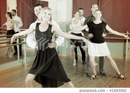 Group of people have fun while dancing waltz Group of people have fun while dancing waltz 41883082