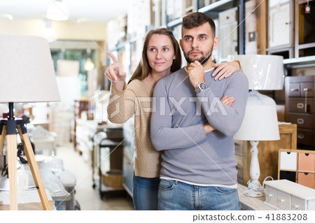 Happy couple in furnishings store Happy couple in furnishings store 41883208