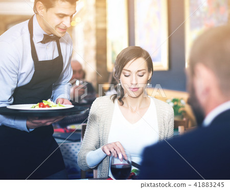 waiter man serving company at restaurant waiter man serving company at restaurant 41883245