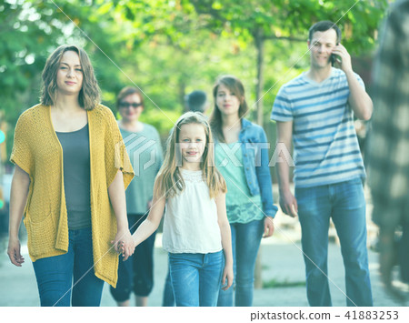 People of different ages walk in park 41883253