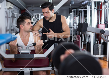 Guy with trainer in gym 41883505