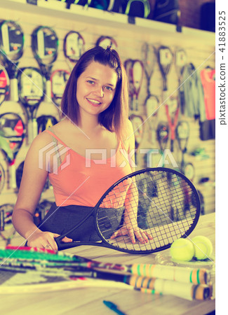Girl holding racket for badminton Girl holding racket for badminton 41883525