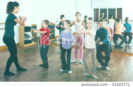 children studying folk style dance in class 41883772