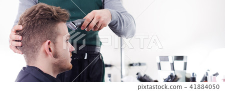Hairdresser doing new haircut 41884050