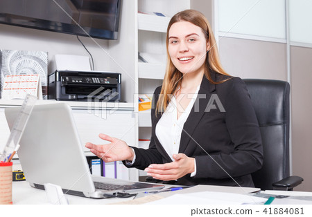Woman working on laptop Woman working on laptop 41884081