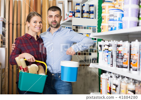 Man and girl with paint and all instruments for repair 41884280