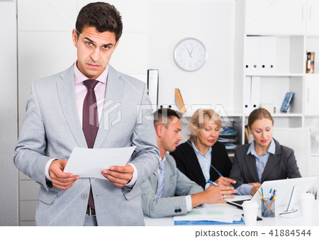 Businessman feeling angry to coworkers Businessman feeling angry to coworkers 41884544