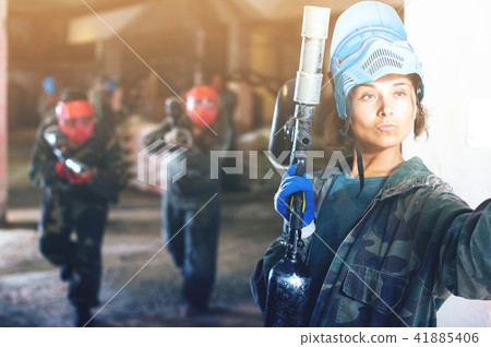 female player is making selfie in paintball battle 41885406