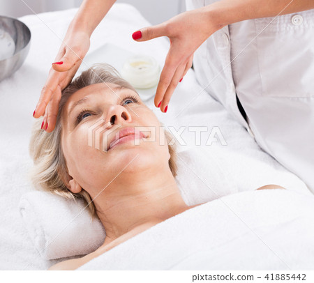 Mature woman having face massage 41885442
