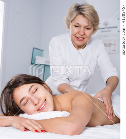 Young woman having massage Young woman having massage 41885457