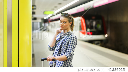 Portrait of pretty girl waiting for train 41886015