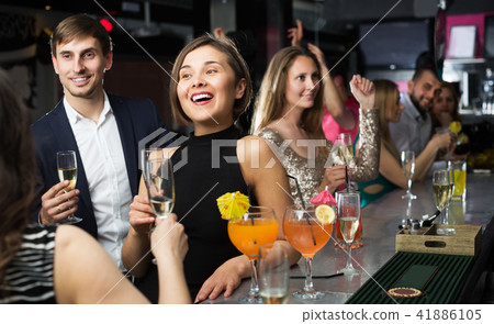 Females and males celebrating corporate Females and males celebrating corporate 41886105