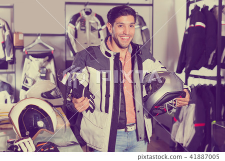 Active man is choosing new gloves 41887005