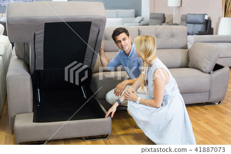 Portrait of family who are looking new sofa-transformer 41887073