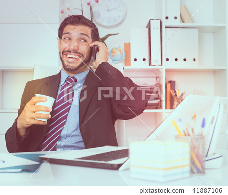 Smiling businessman is talking phone with his partner 41887106