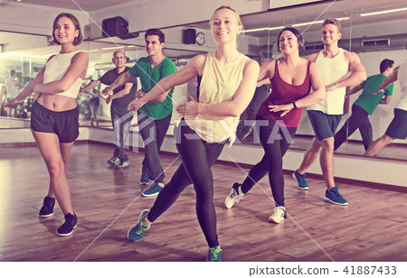 Glad positive people learning zumba steps Glad positive people learning zumba steps 41887433