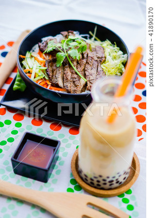 Vietnamese food with vermicelli and grilled pork 41890170