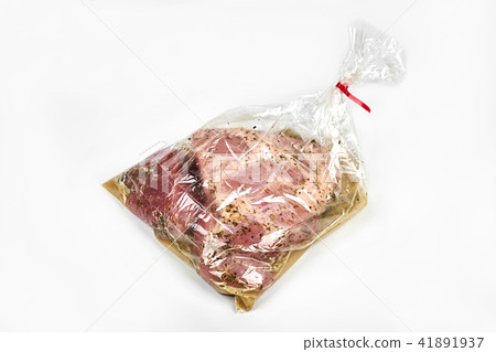 fresh meat packaged in a sleeve with spices, for baking is ready for baking, isolated on white 41891937