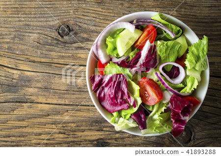 Fresh vegetables salad on wooden table Fresh vegetables salad on wooden table 41893288