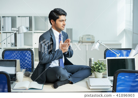 Businessman doing yoga 41896903