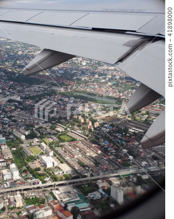crop view of a white silver metallic airplane wing 41898000